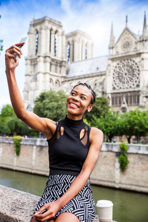 Tourist in Paris, selfie in Notre Dame